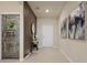 A modern entryway featuring unique wall decor and design elements, creating a stylish and welcoming space at 2176 Lelani Cir, Davenport, FL 33897