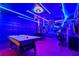 Entertaining Marvel themed game room featuring unique lighting, game tables and Marvel accents at 2176 Lelani Cir, Davenport, FL 33897