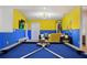 Spacious game room with vibrant colors, a pool table, and comfortable seating area for entertainment at 2176 Lelani Cir, Davenport, FL 33897