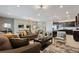 Expansive living area featuring neutral tones, recessed lighting, and an open floor plan flowing into the dining and kitchen areas at 2176 Lelani Cir, Davenport, FL 33897