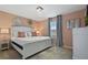 Comfortable primary bedroom featuring a queen bed, modern decor, and ample natural light at 2176 Lelani Cir, Davenport, FL 33897