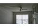 Bedroom featuring neutral walls, a ceiling fan, and a window with blinds for privacy at 2219 San Vittorino Cir # 106, Kissimmee, FL 34741