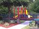 Community playground area with colorful climbing structures and swings, perfect for Gathering fun at 2219 San Vittorino Cir # 106, Kissimmee, FL 34741