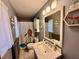 This bathroom is styled with a unique giraffe shower curtain and a hexagon shelf at 2266 Lake Lizzie Ct, St Cloud, FL 34771