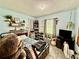 Bright bedroom with ample shelving, decorative toys and a patterned rug at 2266 Lake Lizzie Ct, St Cloud, FL 34771