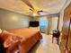 A bedroom featuring neutral walls and an orange bedspread at 2266 Lake Lizzie Ct, St Cloud, FL 34771