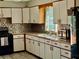 This kitchen has light cabinets, tile backsplash and modern appliances at 2266 Lake Lizzie Ct, St Cloud, FL 34771