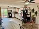 Bright eat-in kitchen features light cabinets, modern appliances, tiled backsplash, and wood-look tile floors at 2266 Lake Lizzie Ct, St Cloud, FL 34771