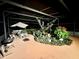 Covered patio area with seating, dining area, and lots of plants at 2266 Lake Lizzie Ct, St Cloud, FL 34771