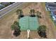 Aerial view of the community amenities featuring a tennis court and a basketball court at 2685 Oneida Loop, Kissimmee, FL 34747