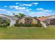 Backyard view showcasing screened patios, white picket fences, and lush green hedges enhancing privacy at 2685 Oneida Loop, Kissimmee, FL 34747