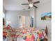 Bright bedroom featuring a large decorative bed, side tables, and a television at 2685 Oneida Loop, Kissimmee, FL 34747