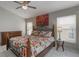 Bright bedroom featuring a large decorative bed, side tables, and large windows at 2685 Oneida Loop, Kissimmee, FL 34747