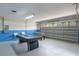 Spacious garage features a foosball table, pool table and a blue and white color scheme at 2685 Oneida Loop, Kissimmee, FL 34747