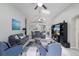 Open living area with comfortable seating, media center, and view into dining and kitchen at 2685 Oneida Loop, Kissimmee, FL 34747