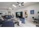 Bright and airy living room featuring skylights, comfortable seating, and view to dining room at 2685 Oneida Loop, Kissimmee, FL 34747