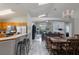 Open floorplan showcasing the kitchen, dining area, and living room, all with bright natural light at 2685 Oneida Loop, Kissimmee, FL 34747