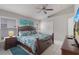 Comfortable main bedroom with decorative bedding, lots of natural light, and a TV at 2685 Oneida Loop, Kissimmee, FL 34747