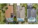 An aerial view of the home showing the roof, pool and proximity to other residences at 307 Balmoral Ct, Davenport, FL 33896