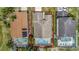 An aerial view of the home showing the roof, pool and proximity to other residences at 307 Balmoral Ct, Davenport, FL 33896