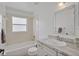 Bathroom with tub, shower, and decorative mirror at 307 Balmoral Ct, Davenport, FL 33896