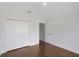 Bedroom with hardwood floors, closet and an ensuite at 307 Balmoral Ct, Davenport, FL 33896