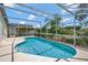 Private pool with an enclosed screened-in lanai, perfect for outdoor enjoyment at 307 Balmoral Ct, Davenport, FL 33896