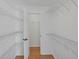 Large walk-in closet with ample shelving, providing organized storage solutions at 307 Balmoral Ct, Davenport, FL 33896