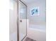 The bathroom features a glass-enclosed shower, soaking tub, and white tiled walls at 321 Lasso Dr, Kissimmee, FL 34747