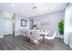 Bright dining room featuring a modern table and chairs, complemented by stylish decor and an inviting atmosphere at 321 Lasso Dr, Kissimmee, FL 34747