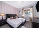 Comfortable main bedroom with a large window and stylish decor at 321 Lasso Dr, Kissimmee, FL 34747