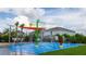 Community splash pad featuring interactive water features and shady seating areas for relaxation at 321 Lasso Dr, Kissimmee, FL 34747