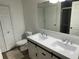 Bathroom with a double sink vanity and modern fixtures at 3301 Soho St # 104, Orlando, FL 32835