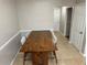 Traditional dining room features a wood table with seating for four at 3301 Soho St # 104, Orlando, FL 32835