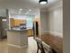 Charming kitchen with wood cabinets, stainless steel appliances, and a breakfast bar at 3301 Soho St # 104, Orlando, FL 32835