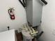 Water heater and HVAC unit with nearby shelving for storage at 3301 Soho St # 104, Orlando, FL 32835