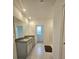 Bright bathroom featuring double vanity with granite counters and tile floors at 3886 Whitney Way, Haines City, FL 33844