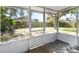 Looking out from the screened-in porch to the spacious backyard and fence at 4215 Red Bird Ave, St Cloud, FL 34772