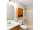 Bright bathroom with a tub, shower, and wood cabinet and vanity at 4215 Red Bird Ave, St Cloud, FL 34772