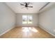 Well-lit bedroom with tile flooring, ceiling fan and a window providing natural light at 4215 Red Bird Ave, St Cloud, FL 34772