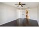 Bedroom featuring dark hardwood floors, a ceiling fan and direct access to the bathroom at 4215 Red Bird Ave, St Cloud, FL 34772