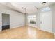 Bright foyer featuring tile flooring, large windows, and a modern light fixture at 4215 Red Bird Ave, St Cloud, FL 34772