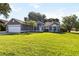 Beautiful single-story home featuring a lush green lawn and mature trees at 4215 Red Bird Ave, St Cloud, FL 34772