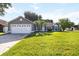 Charming single Gathering home with a manicured lawn and a two car garage at 4215 Red Bird Ave, St Cloud, FL 34772