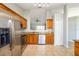Modern kitchen featuring stainless steel appliances and a granite countertop at 4215 Red Bird Ave, St Cloud, FL 34772