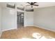 Bright living room with tile flooring, a ceiling fan and an open entrance at 4215 Red Bird Ave, St Cloud, FL 34772