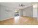 Bright living room with tile flooring, ceiling fan and sliding glass doors to the outside patio at 4215 Red Bird Ave, St Cloud, FL 34772