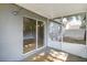 View of the covered patio featuring gray paint and screen at 4215 Red Bird Ave, St Cloud, FL 34772