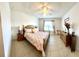 Well-lit primary bedroom featuring a ceiling fan and a window at 4250 Roberta Dr, Winter Haven, FL 33881