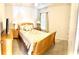 A cozy bedroom with tile floors, matching bedside tables and neutral decor at 4250 Roberta Dr, Winter Haven, FL 33881